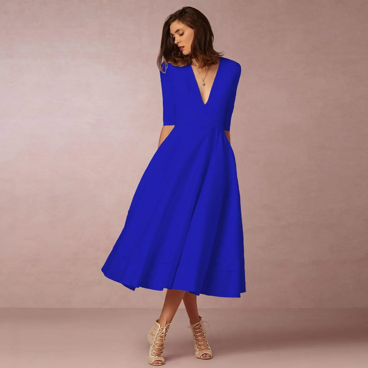 Back view: Women's elegant V-neck elbow-sleeve midi dress, highlighting a graceful silhouette.
