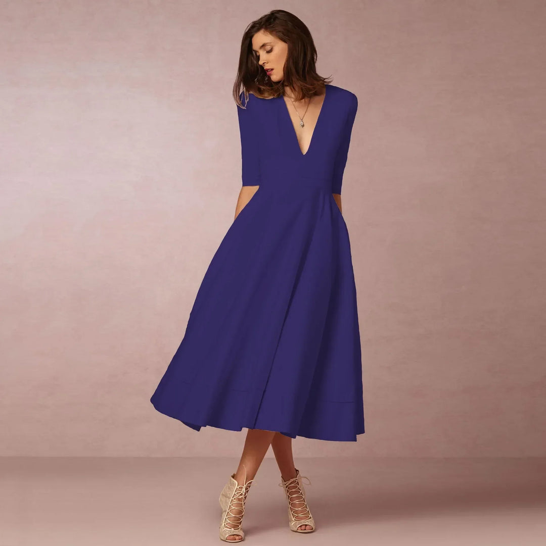 Women's elegant V-neck midi dress with elbow sleeves, a versatile piece for sophisticated fashion.