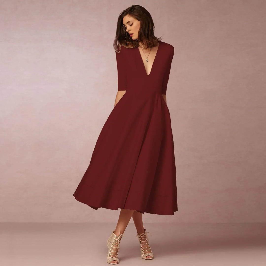 Versatile women's midi dress featuring an elegant V-neck & elbow sleeves for any occasion.