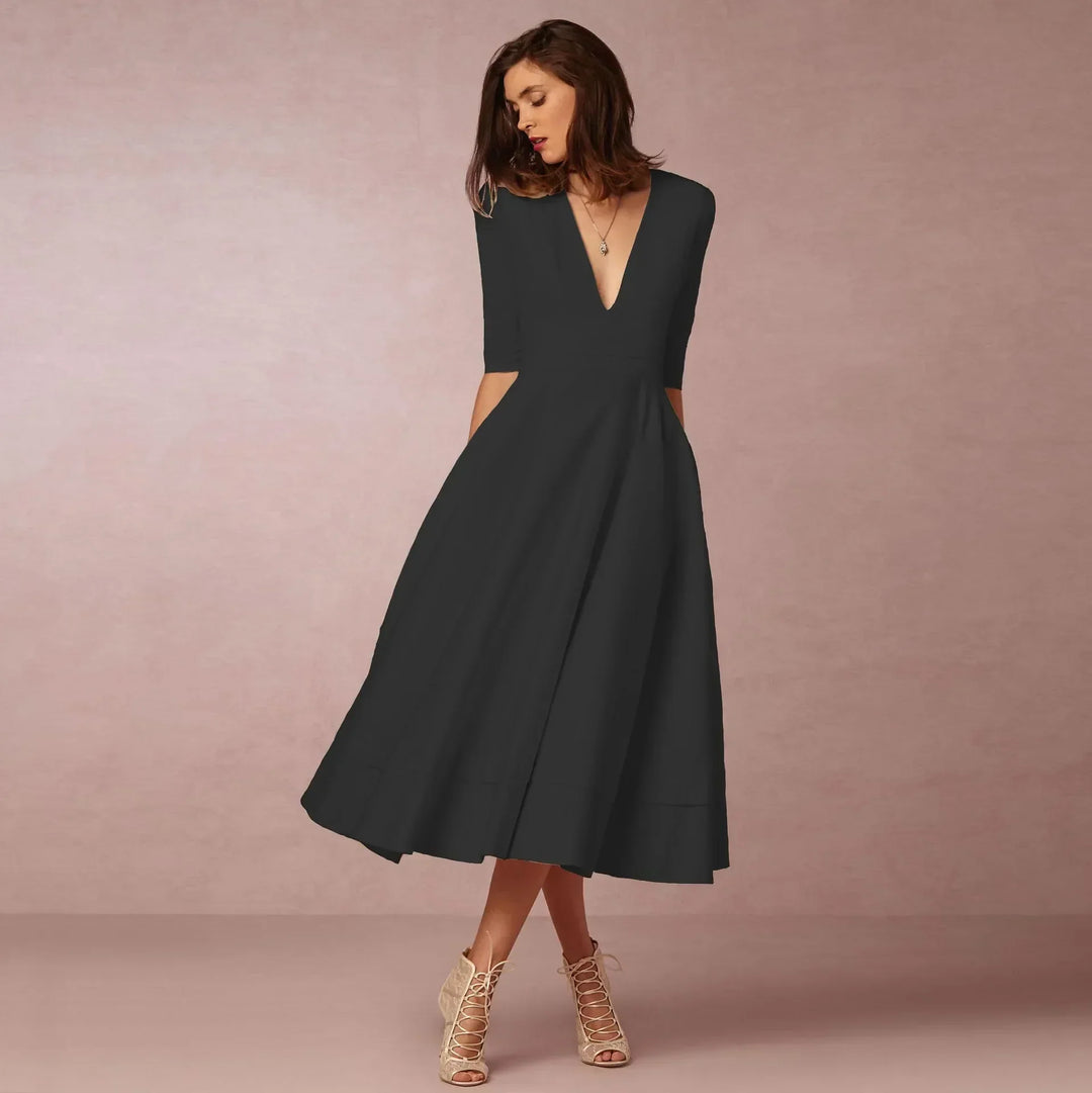 Timeless women's V-neck elbow-sleeve midi dress, an elegant choice for sophisticated fashion.