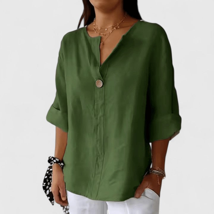 Relaxed fit women's summer blouse with a flattering V-neck and knot, offering comfort and style.