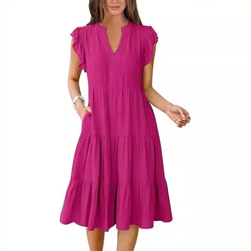 Comfortable summer V-neck tiered midi dress for women with flutter sleeves. An elegant choice for casual outings or spring fashion.