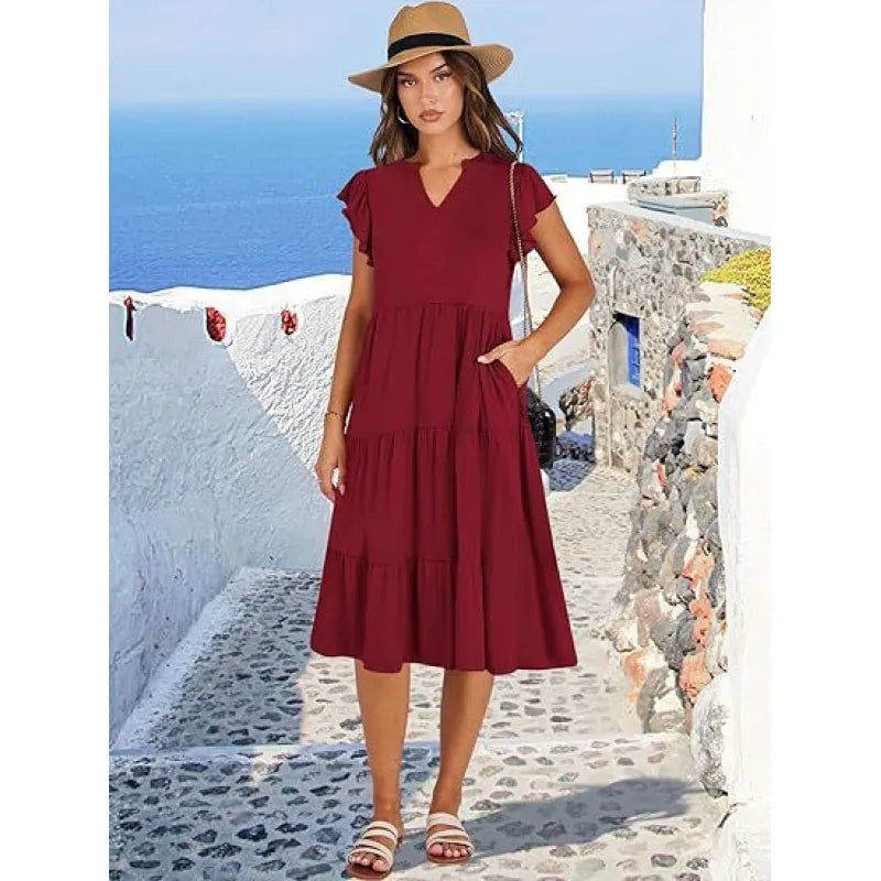 Lightweight elegant V-neck tiered midi dress with flutter sleeves, a comfortable women's summer dress for versatile fashion.
