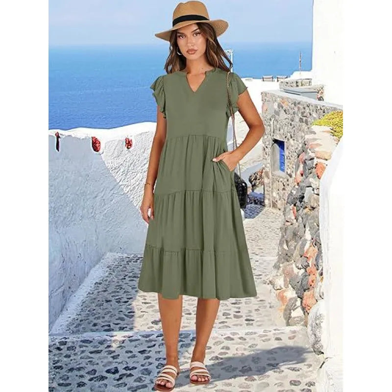 Women's elegant V-neck tiered midi dress with flutter sleeves, showcasing its comfortable & flowy design. Great for spring fashion.
