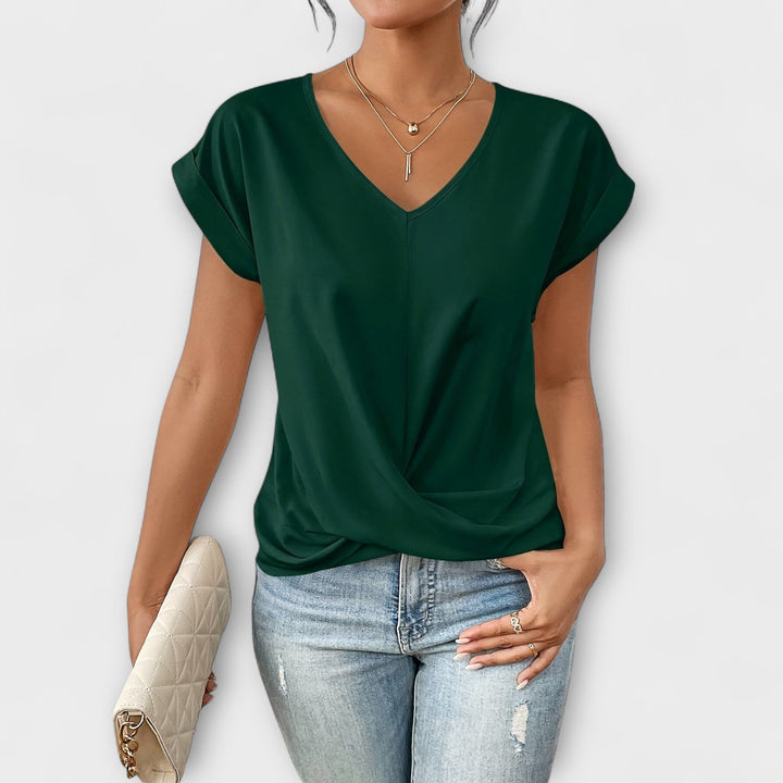 Elegant V-neck blouse for women, featuring button details, versatile for casual or dressy everyday wear.