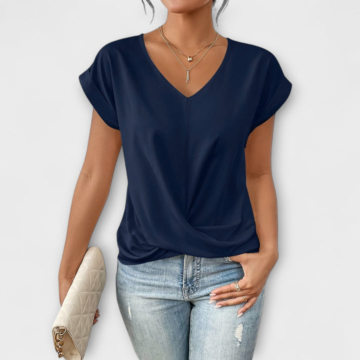 Casual chic V-neck women's top with elegant button detail, comfortable long sleeves, versatile and stylish.