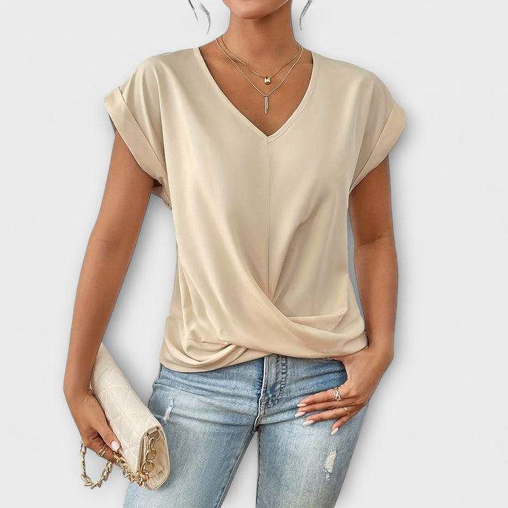 Classic long-sleeve V-neck women's shirt, elegant button detail, versatile fashion staple for any wardrobe.