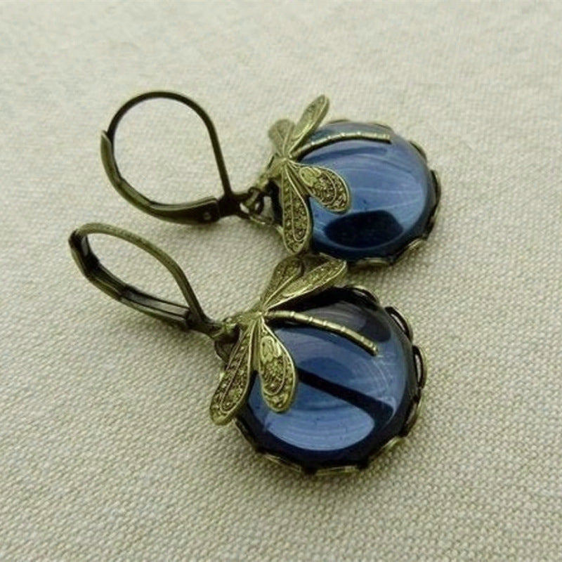 Delicate vintage butterfly stud earrings for women, elegant fashion jewelry from the Aurora Collection.