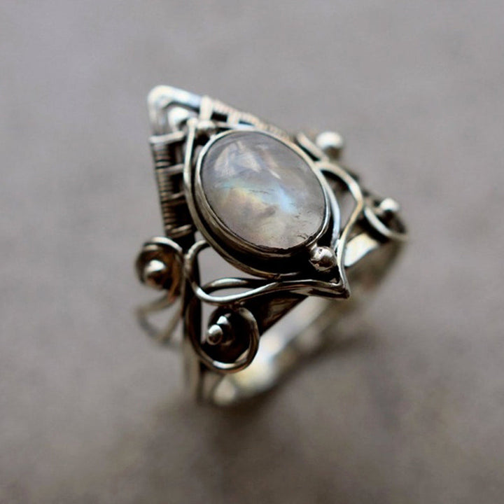 Elegant vintage women's moonstone ring, oval gemstone set in intricate silver. Perfect boho jewelry gift.