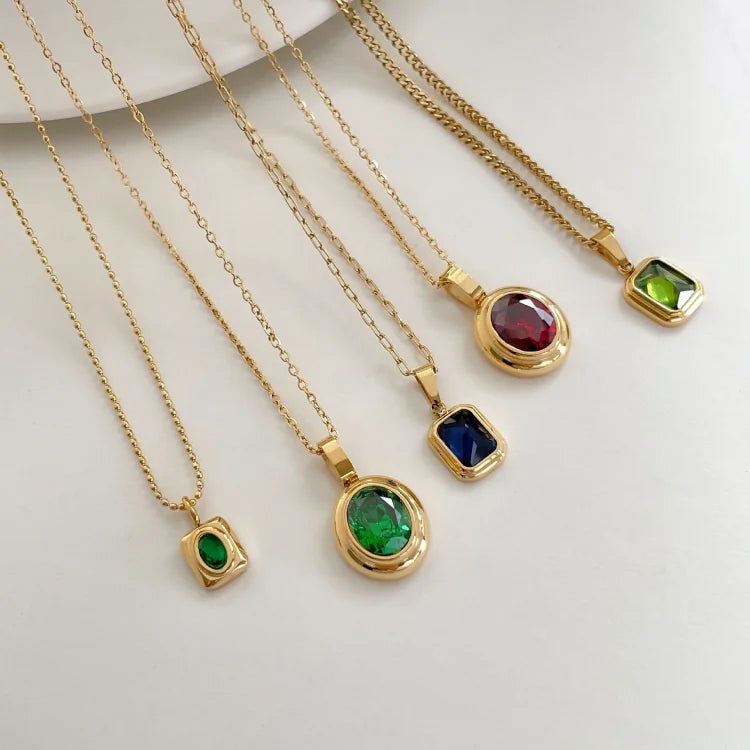 Vintage women's Celeste necklace featuring an oval gemstone pendant with an elegant gold finish.