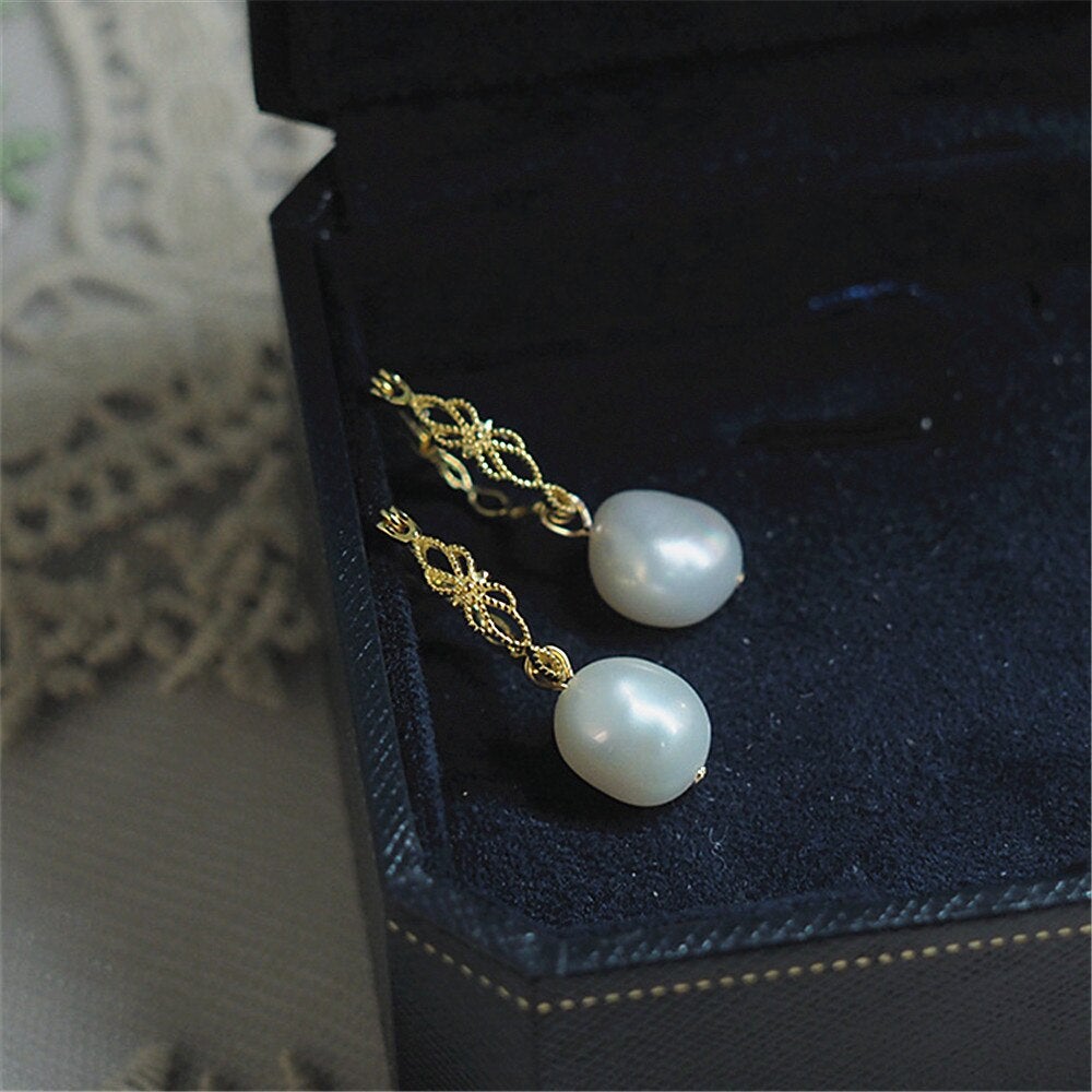 Elegant Vivienne natural pearl drop earrings for women, gold-plated 925 silver, perfect for a classic, sophisticated look.