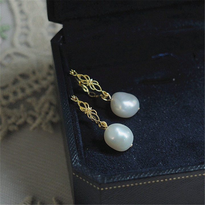 Elegant Vivienne natural pearl drop earrings for women, gold-plated 925 silver, perfect for a classic, sophisticated look.
