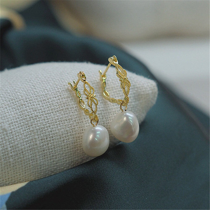 Vivienne natural pearl drop earrings, featuring genuine pearls & exquisite gold-plated 925 silver design. Elegant jewelry.
