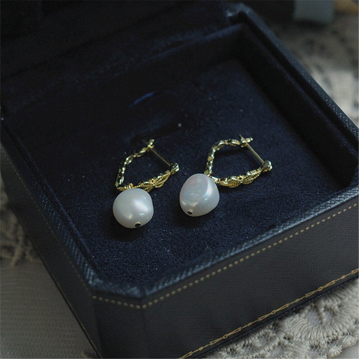 Stylish Vivienne natural pearl drop earrings for women. Gold-plated 925 silver, an elegant & spiritual jewelry piece.