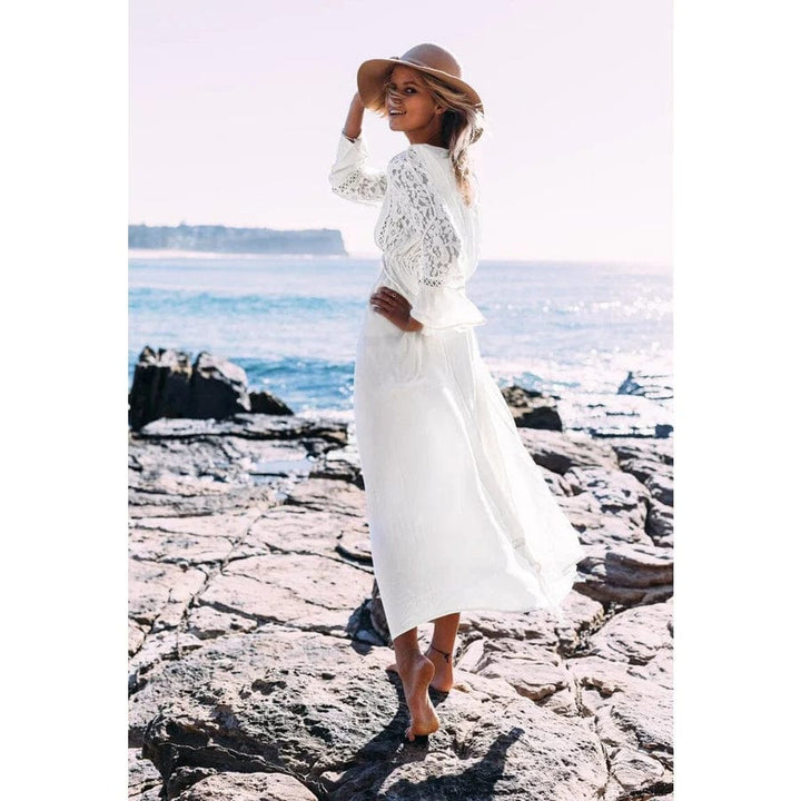 Women's effortless white maxi dress, ideal for everyday style. Comfortable, elegant, and flowy for summer fashion.