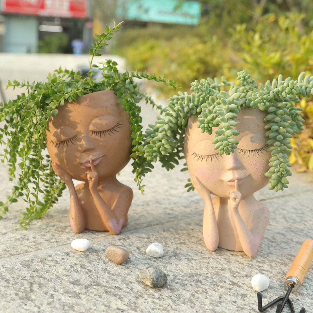 Elegant white goddess head planter pot for indoor gardens or outdoor patios, ideal for succulents & small plants.