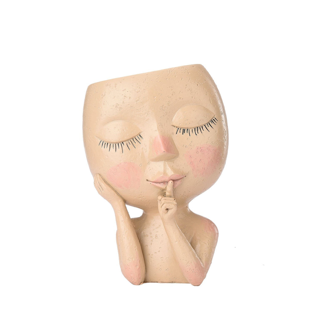 Beautiful goddess head planter for plants, a resin pot creating a stunning focal point in any indoor or outdoor garden.