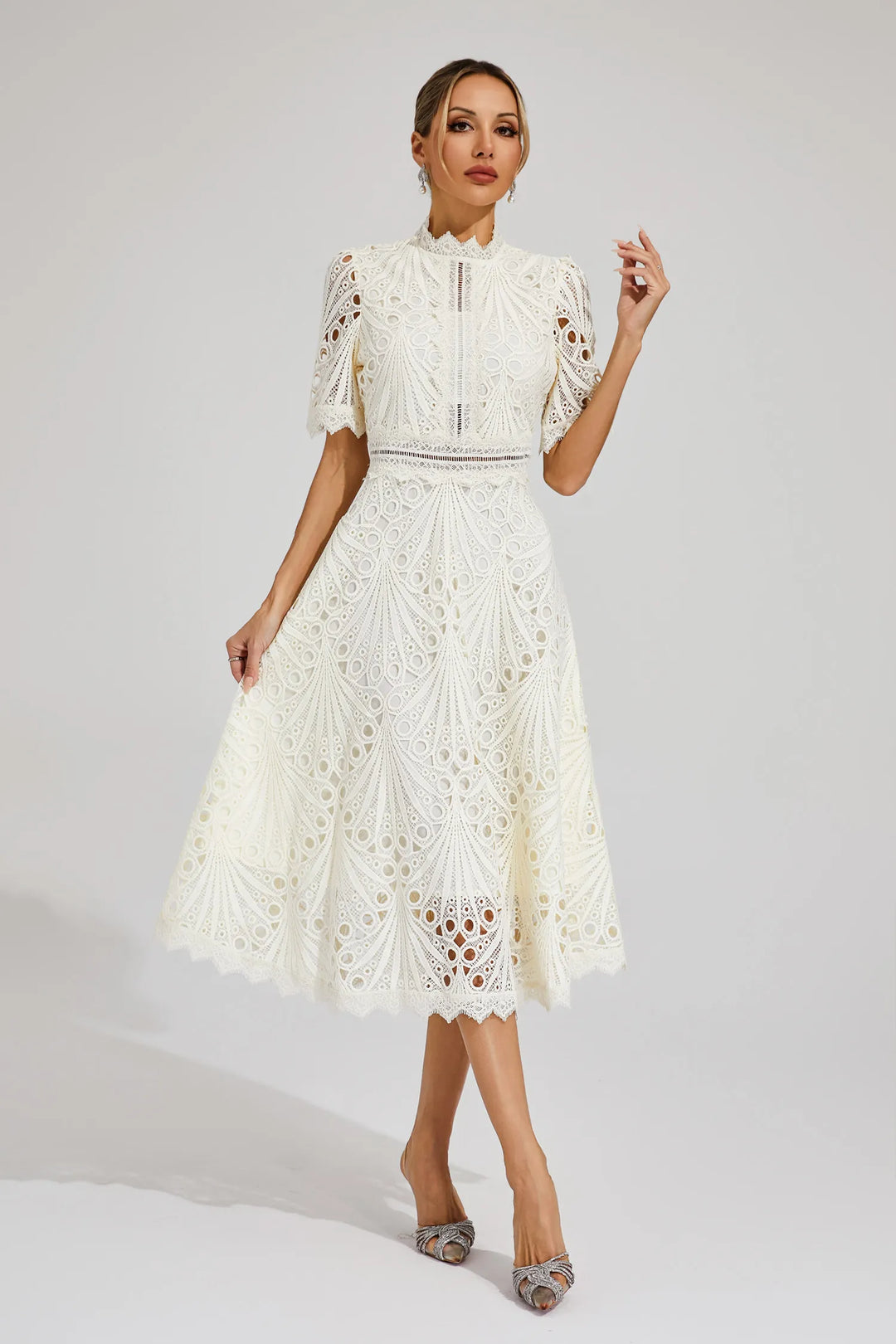 Back view of an elegant hot pink lace midi dress, perfect for a wedding guest.