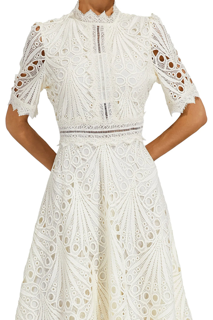 Flowy white lace midi dress for women, comfortable & elegant for summer parties.