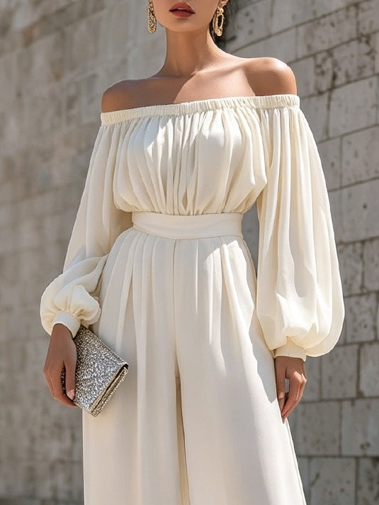 Women's elegant white maxi dress, off-shoulder neckline & bishop sleeves. Ideal for wedding guest or party attire.