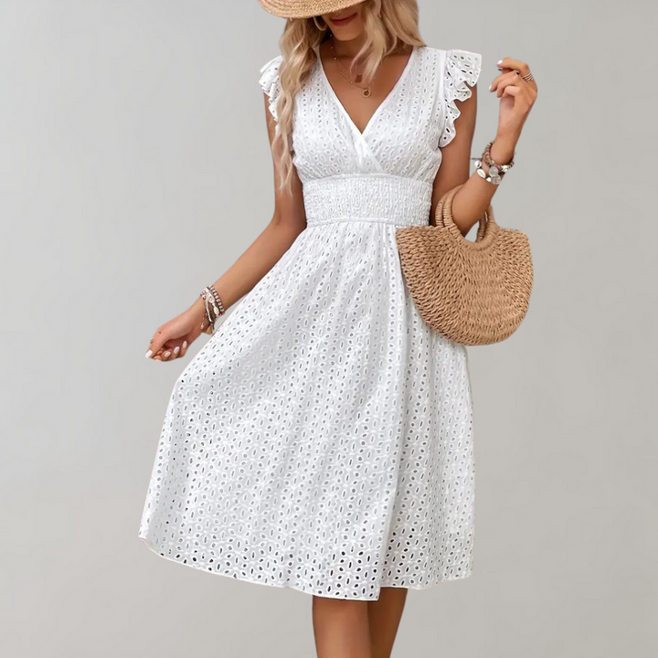 Versatile white casual dress with ruffled sleeves, perfect for summer days, vacations, or elegant events.