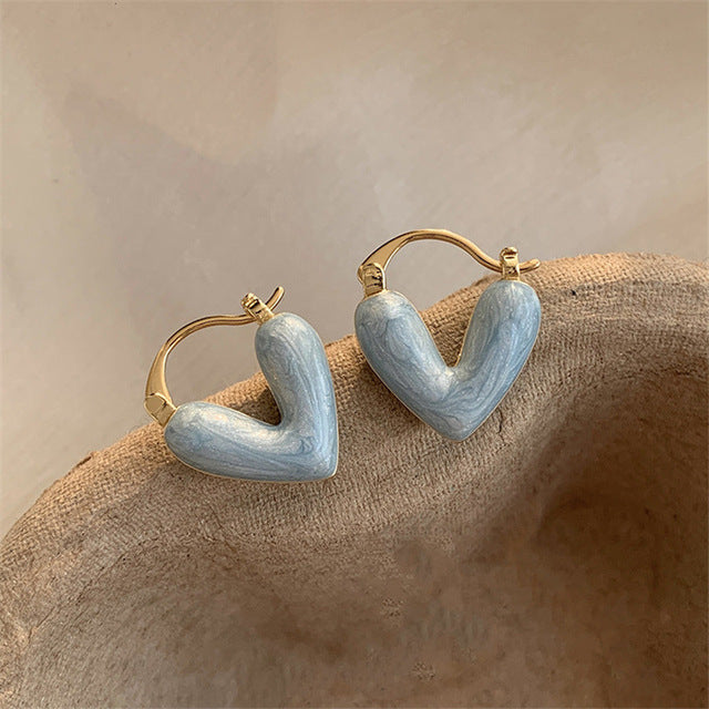 Women's elegant teardrop dangle earrings, white and gold-plated. Love Collection fashion jewelry accessory.