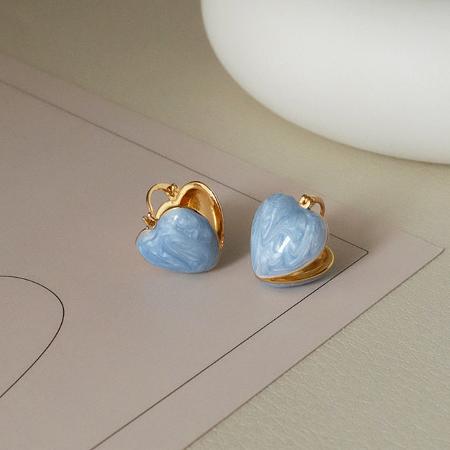 Stunning women's white teardrop dangle earrings, gold-plated. Elegant love-inspired jewelry accessory.