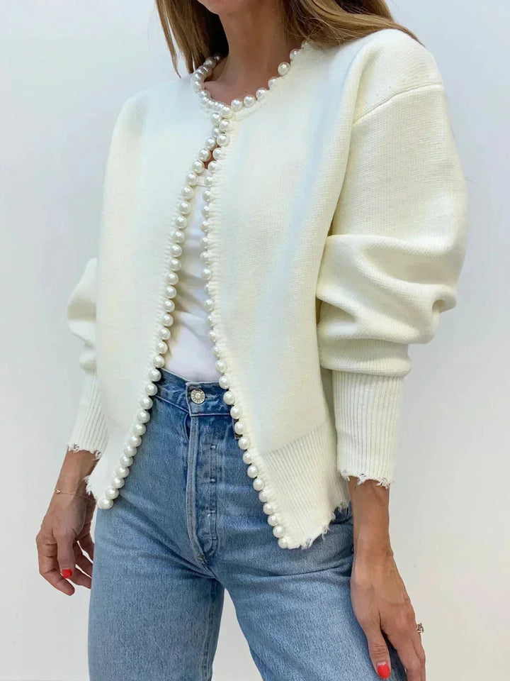 Black women's knit cardigan featuring delicate pearl trim, ideal for workwear or a stylish brunch outfit.
