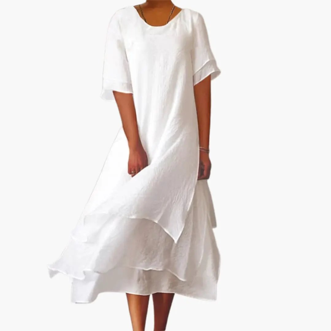 Elegant white women's sleeveless midi dress with a round neckline, perfect for casual summer wear or day-to-night styling.