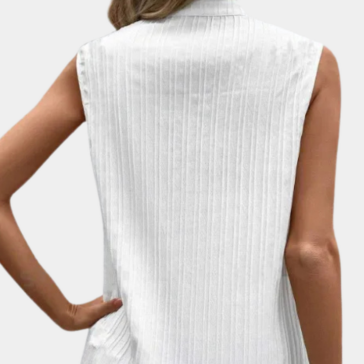 Timeless white women's top, offering versatile style for both casual and formal occasions. Elegant & comfortable.
