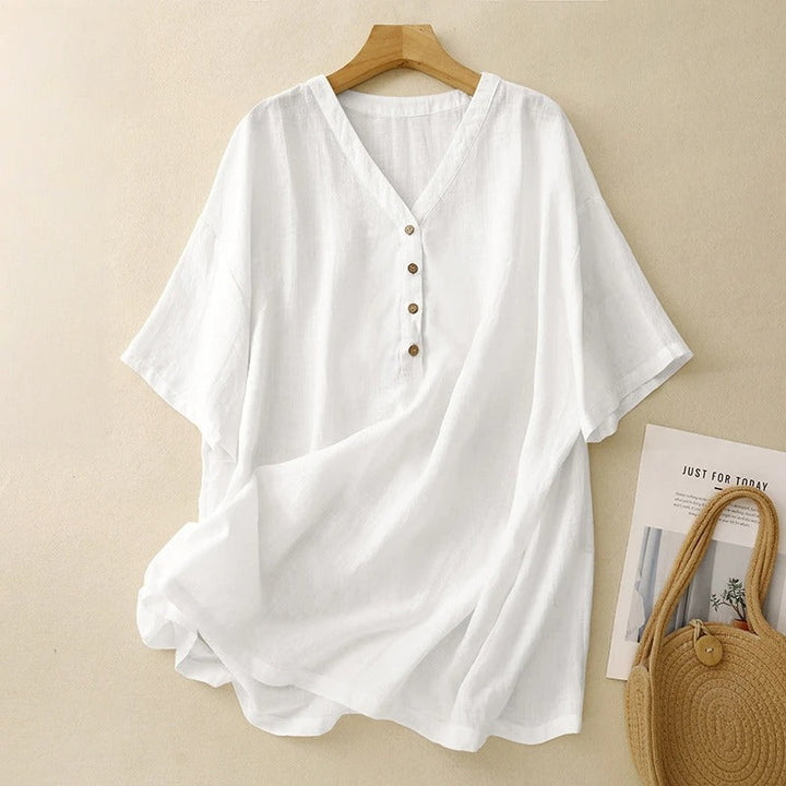 Elegant white women's V-neck blouse with half sleeves, ideal for chic spring and summer casual wear.