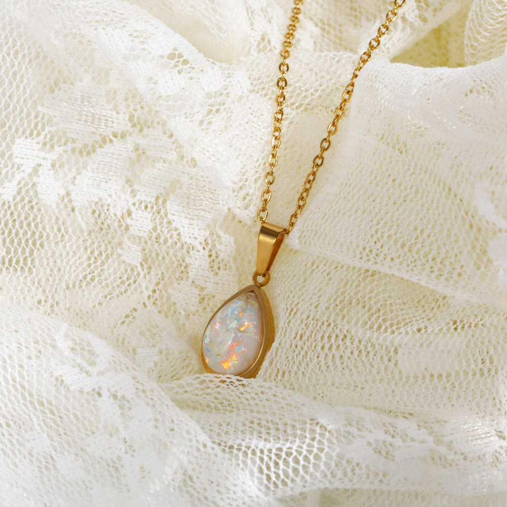 Dainty 18K gold necklace for women, adorned with a captivating natural opal drop pendant. Fine jewelry.
