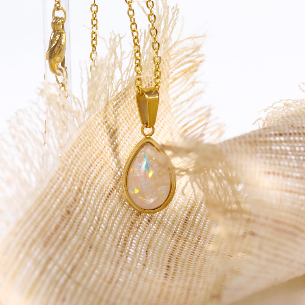 Exquisite natural opal drop pendant on an 18K gold necklace, designed for elegant women's wear.