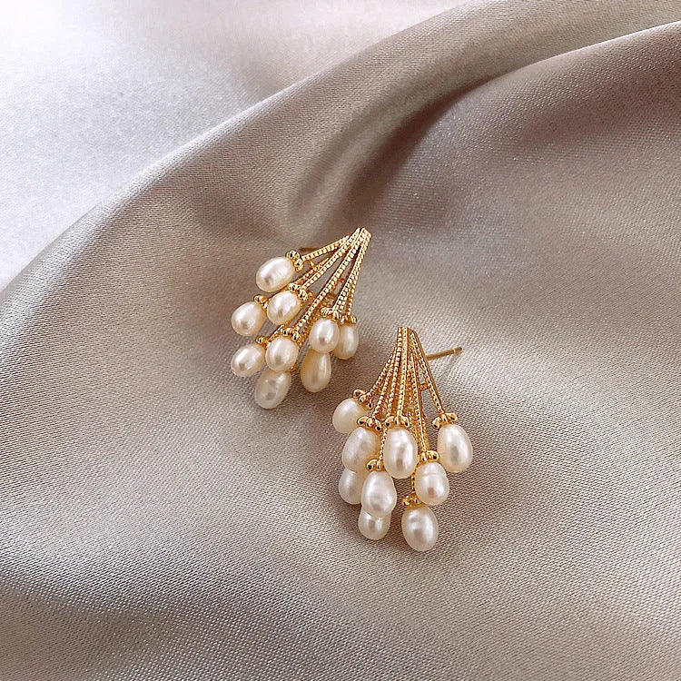 Elegant women's 18K gold-plated silver pearl tassel earrings. Chic, hypoallergenic statement jewelry for any look.