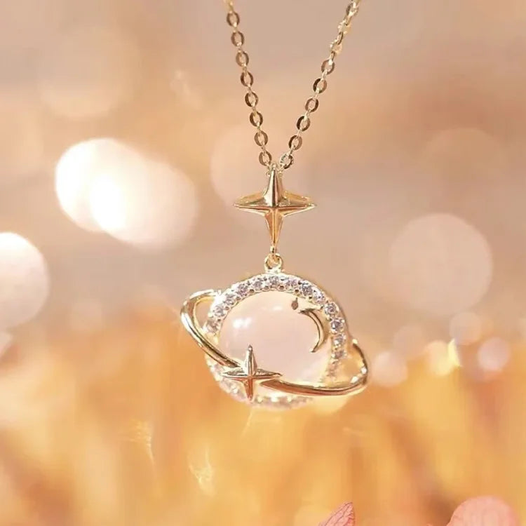 Trendy women's gold planet pendant necklace, 18k gold plated celestial jewelry fashion accessory.