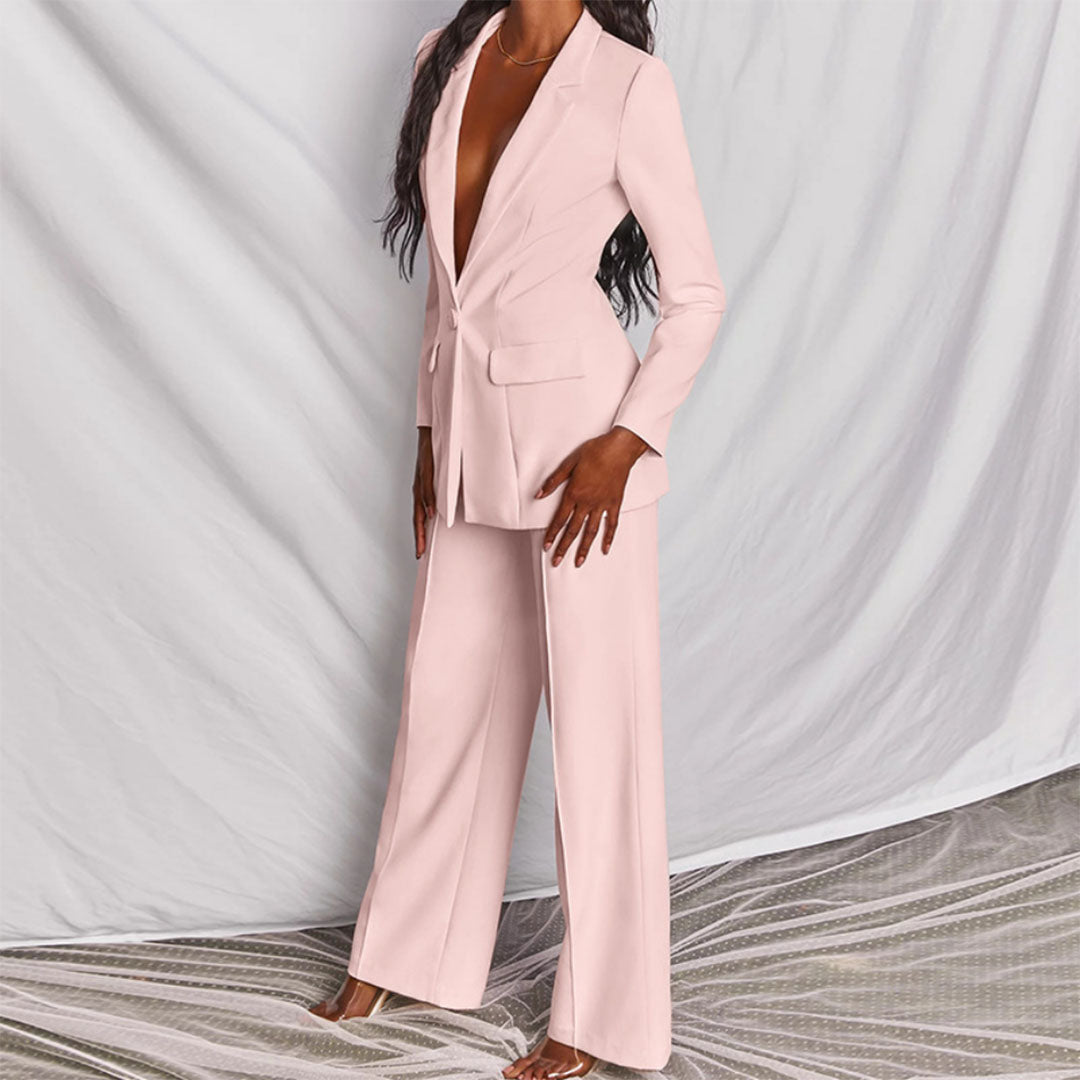 Sophisticated women's blazer and trouser set, a stylish matching outfit for work or evening.