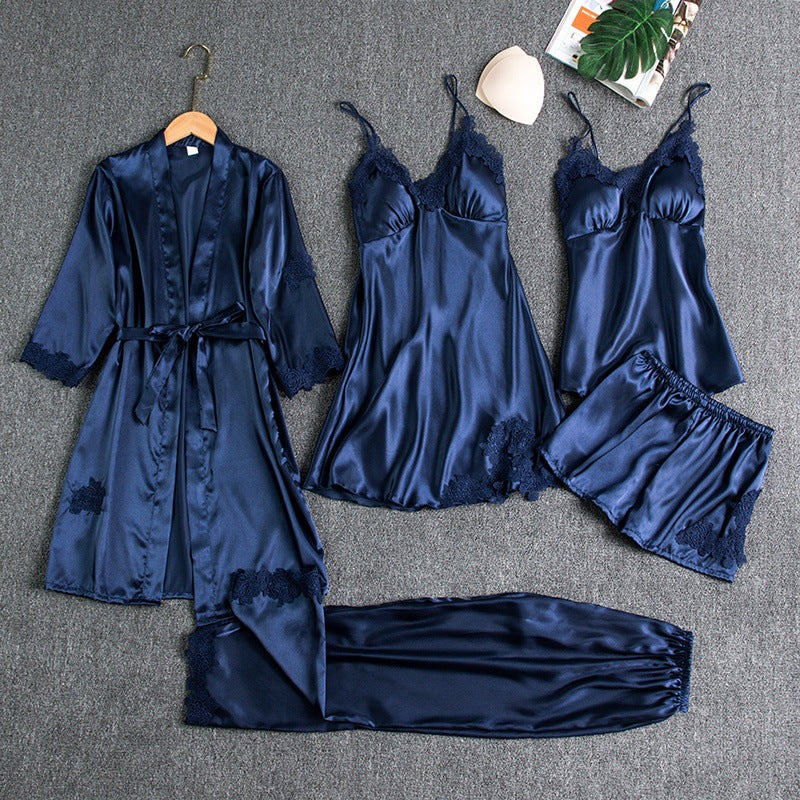 Luxurious women's multi-piece satin pajama set featuring a soft robe, lace camisole, shorts, and long pants.