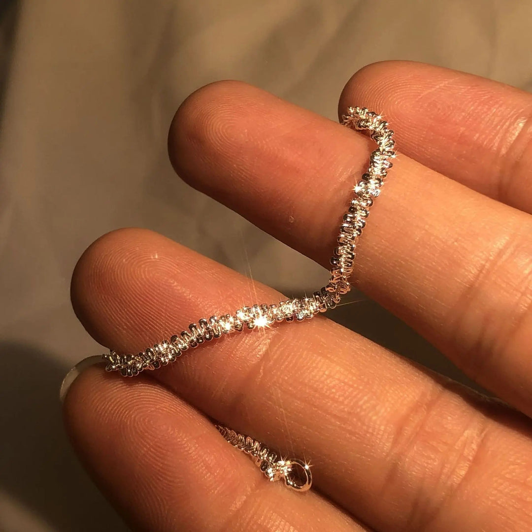 Versatile women's silver liquid shine bracelet. Adjustable, 925 sterling silver for elegant daily or evening wear.