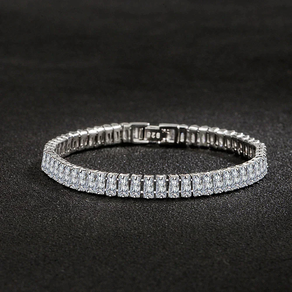 Women's elegant 925 sterling silver bracelet with shimmering crystals, worn beautifully on a wrist.