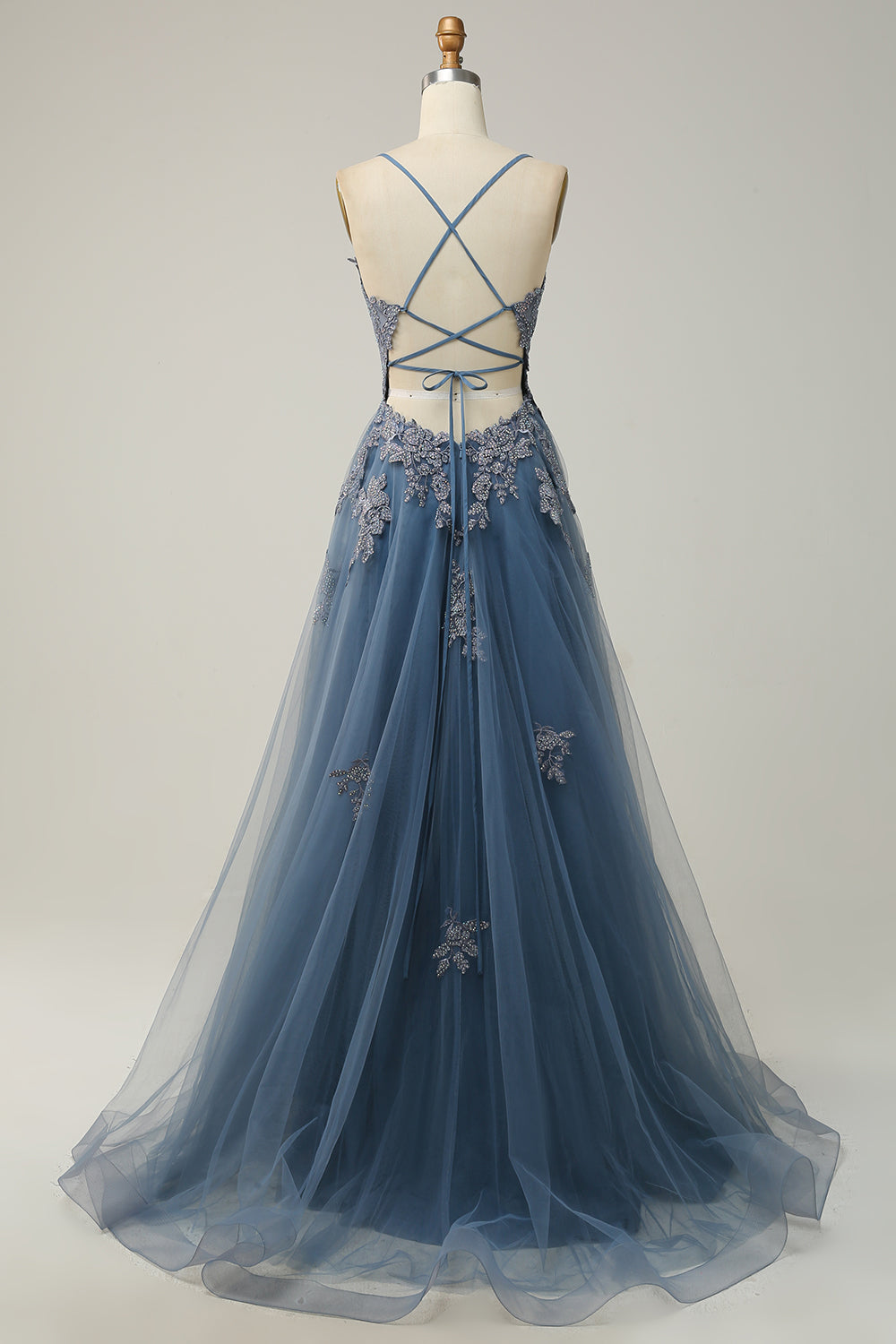 Flowing A-Line Evening Gown for women, spaghetti straps & lace-up back. Elegant movement, formal events.