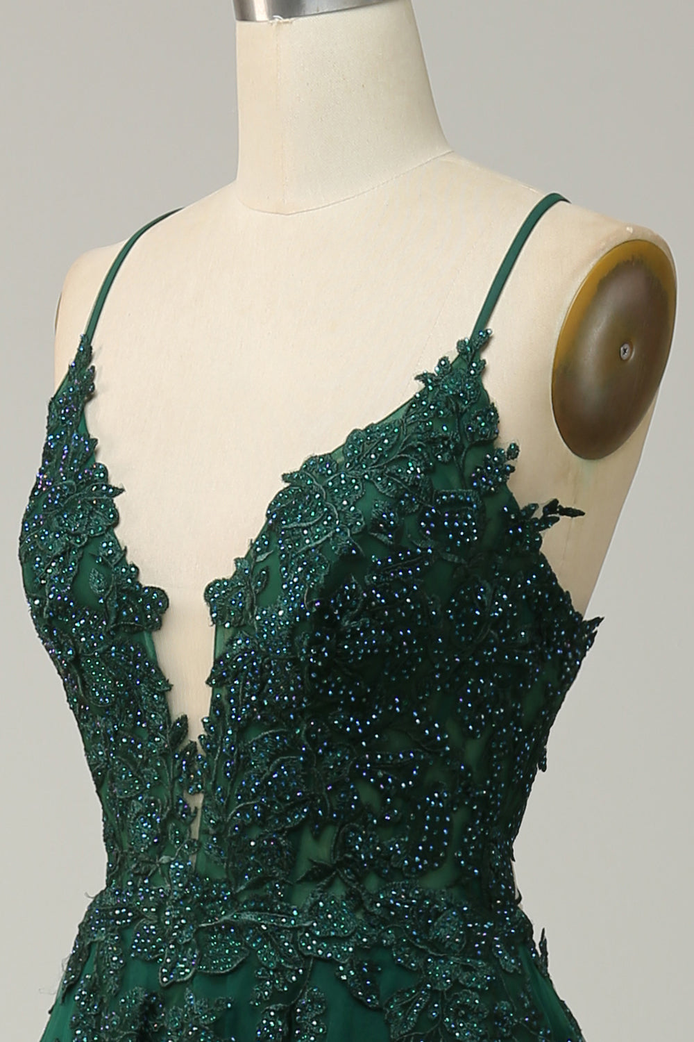 Woman models elegant A-Line Evening Gown, spaghetti straps, lace-up back. Perfect prom dress for women.