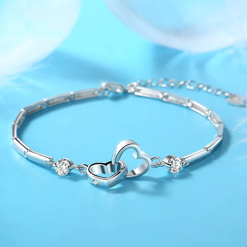 Adjustable 925 sterling silver double heart bracelet for women, comfortable and elegant fine jewelry.