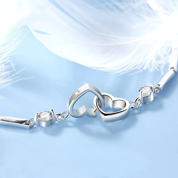 Lovely sterling silver double heart bracelet, an adjustable and elegant gift for women. Hypoallergenic.