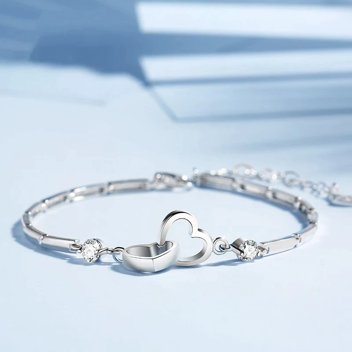 Shimmering 925 sterling silver double heart bracelet for women, adjustable and durable fine jewelry piece.