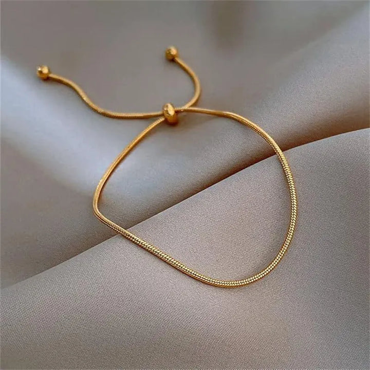 Durable metal-tone adjustable chain anklet for women, a stylish and comfortable foot accessory.
