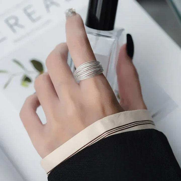 Gold plated sterling silver adjustable layered ring for women, showcasing delicate filigree details and elegant style.