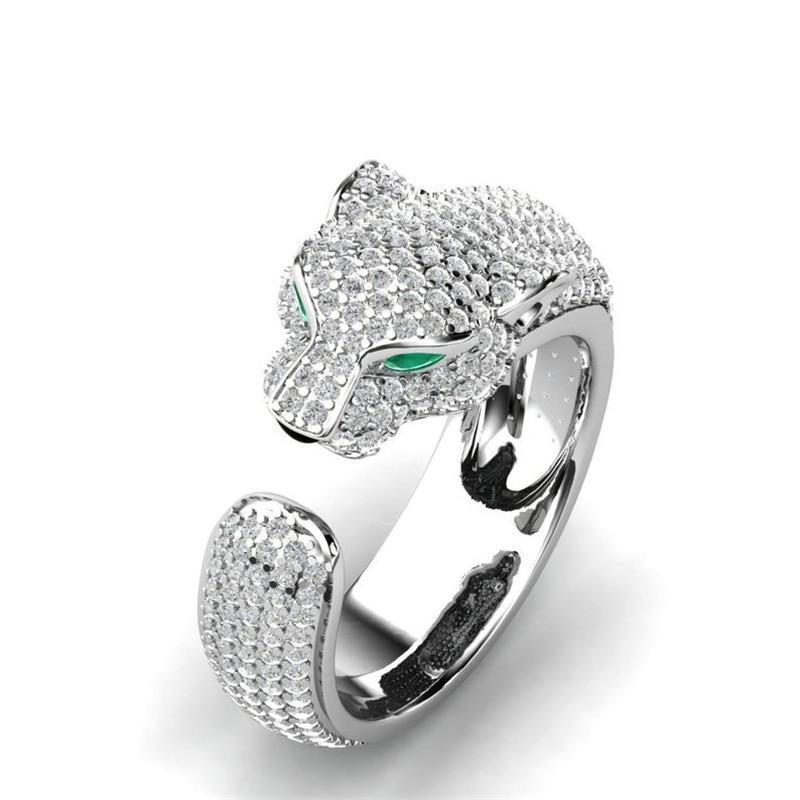 Elegant women's adjustable panther ring with 18K silver, rosé gold, and sparkling green zirconia eyes. Statement animal jewelry.