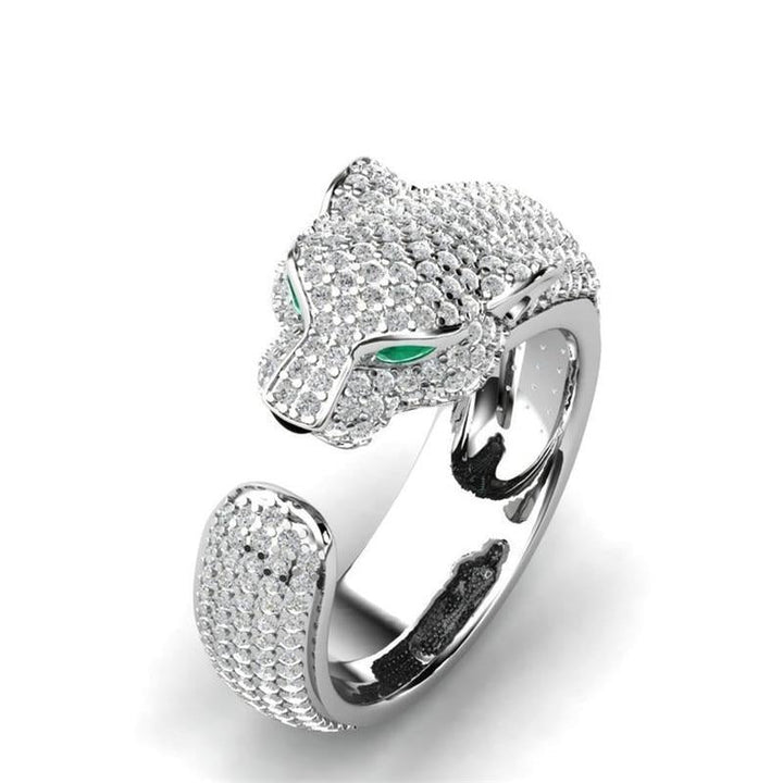 Elegant women's adjustable panther ring with 18K silver, rosé gold, and sparkling green zirconia eyes. Statement animal jewelry.