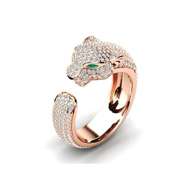Stunning adjustable women's Jaguar ring: 18K silver & rosé gold, intricate design with vibrant green zirconia eyes.