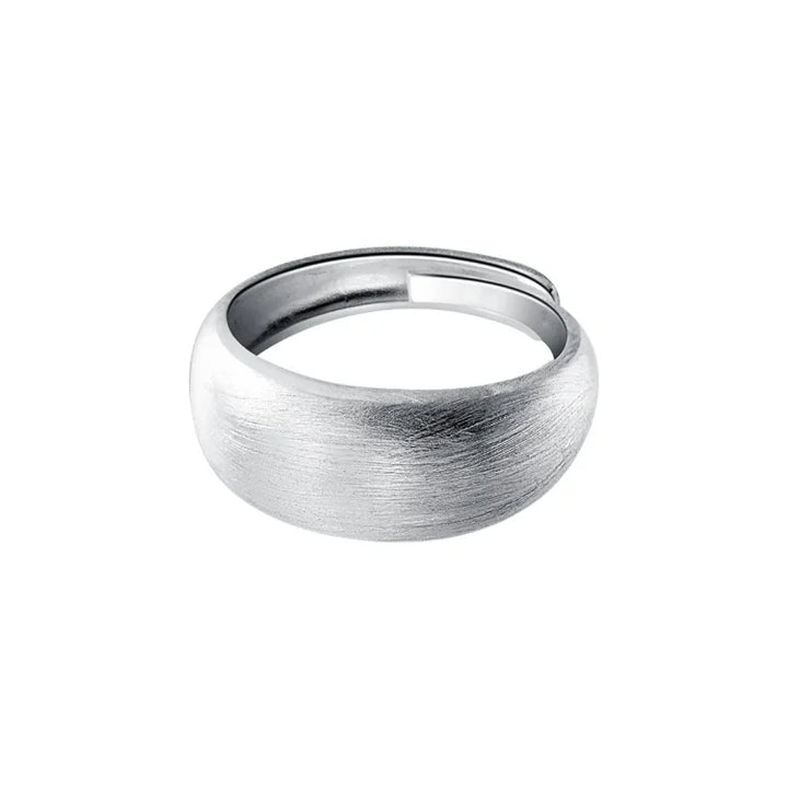 Elegant women's adjustable pure silver dome ring with a brushed finish. Timeless and versatile fashion jewelry.